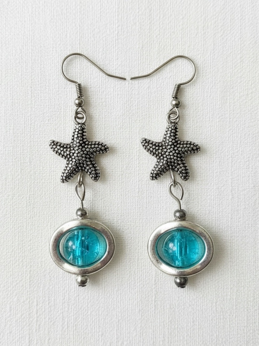 Mermaid eye with starfish earrings.